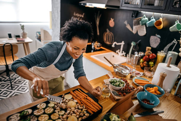 istock Woman watching recipe in digital tablet 1356199625