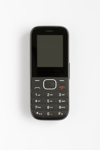 Small Old Black Mobile Phone - On White Background