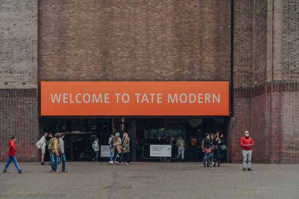 Welcome sign at the entrance of Tate Modern museum in London, UK. London, UK - October 17, 2021: Welcome sign at the entrance of Tate Modern, a museum in London that holds the nation's collection of modern art from 1900 to the present day. bankside photos stock pictures, royalty-free photos & images
