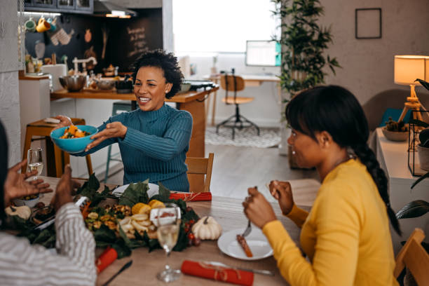 istock Three women having leisure time while having food and drinks 1356201838
