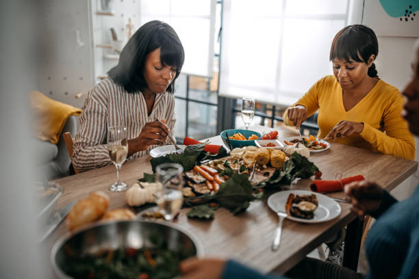 istock Three women having leisure time while having food and drinks 1356202005