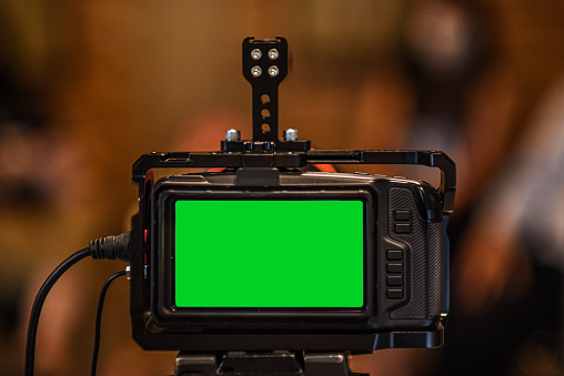 Close-up of Video camera streaming live with hroma key green screen template