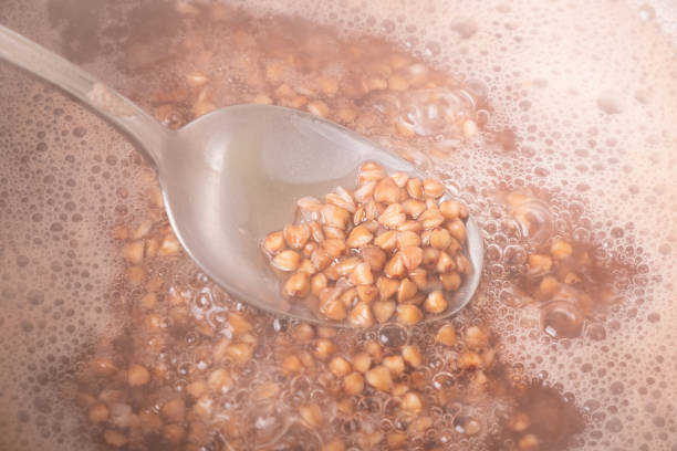 cooking buckwheat, steamed buckwheat on a spoon.