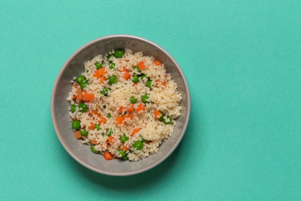 istock Couscous with fresh vegetables - peas, carrots, 1356204342