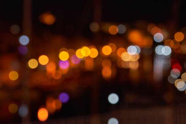 istock Blurred bokeh of glowing bulbs. Full frame blurred lights and reflections background 1356204427