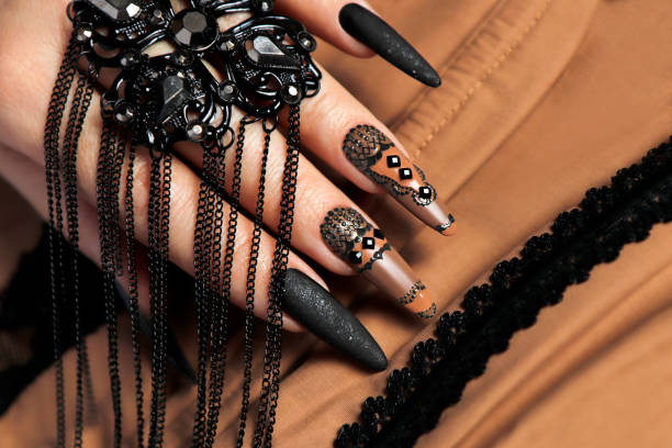 istock Nail design with black and beige nail polish . 1356204746