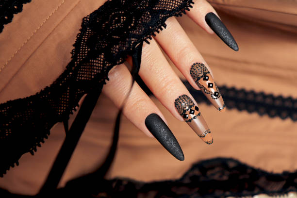 istock Nail design with black and beige nail polish . 1356204747