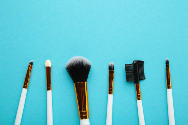 istock Set of makeup brushes on blue background. 1356204903