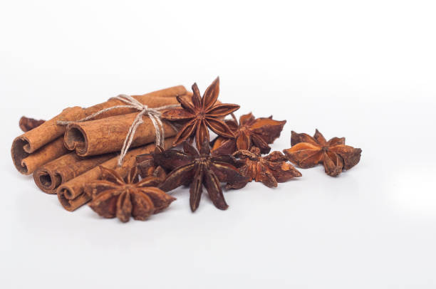 Cinnamon sticks and star anise on a white background stock photo