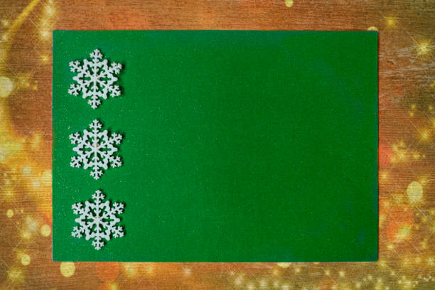 Christmas background with green empty card. Space of text; stock photo