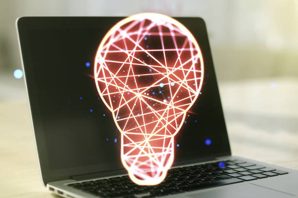 istock Double exposure of creative light bulb hologram on laptop background, research and development concept 1356206524