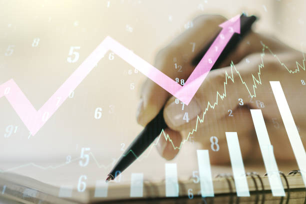 istock Abstract creative financial graph with upward arrow and woman hand writing in notebook on background, forex and investment concept. Multiexposure 1356206608