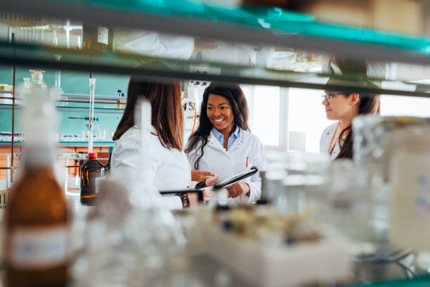 istock A small group of female scientists enjoy conversation during a break in the laboratory. 1356210468
