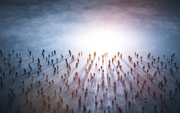 istock Crowd of diverse people walk to light. 1356210526