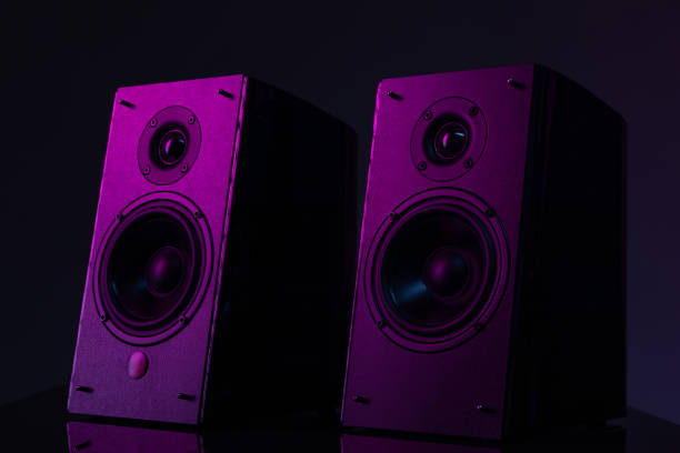 istock speaker system with large speakers on a black background with purple atmospheric lighting 1356215375