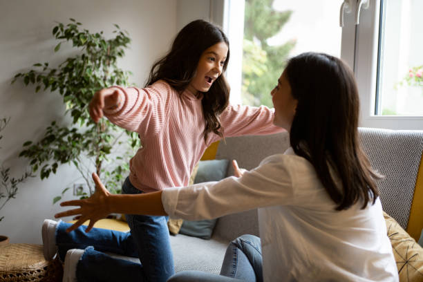 istock Girl jumping into her mother hug 1356217415