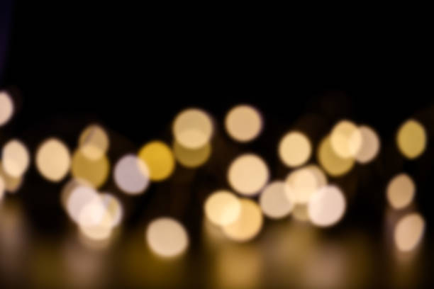 istock Abstract blurred bokeh light with warm tone color background 1356218459