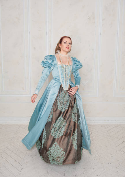 istock Beautiful young woman in medieval style dress move 1356218921