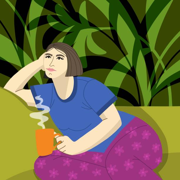 Sad girl with coffee sitting on the couch at home Sad girl with coffee sitting on the couch at home tired woman coffee stock illustrations