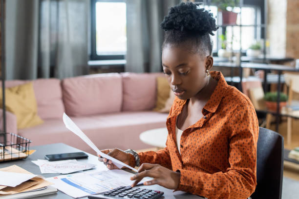 istock Blackwoman Calculating Tax Bill 1356223280