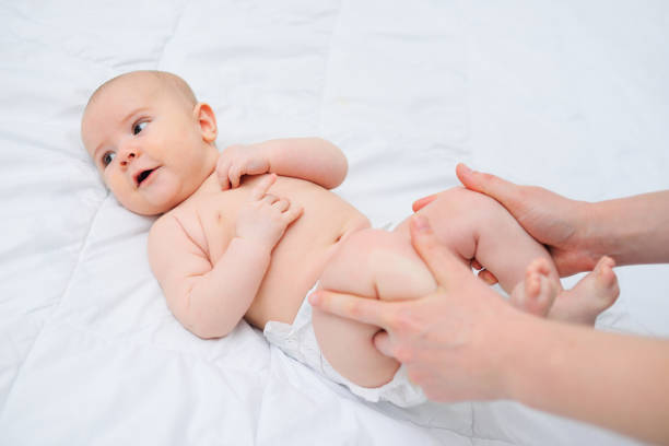 istock Massage a newborn baby against bloating and colic 1356223385