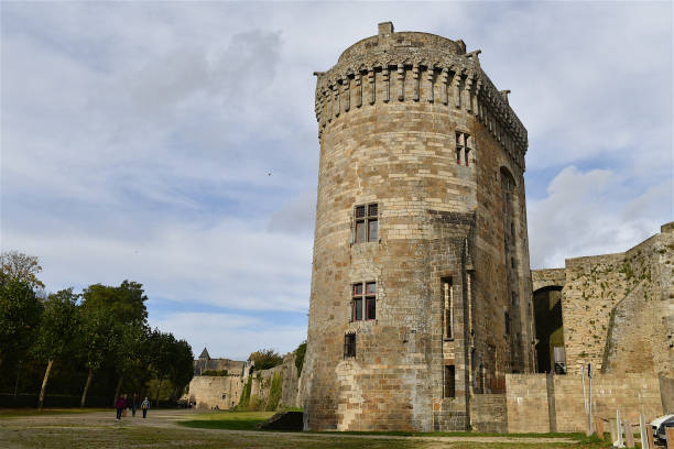 Dinan, France-10 29 2021: People passing next to  a fortified tower of the Dinan castle, France.
