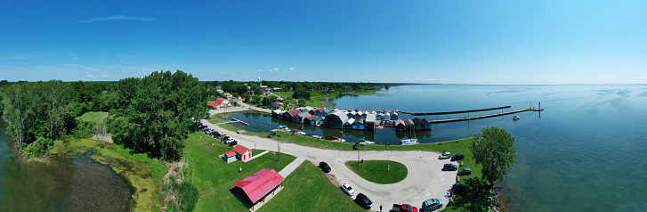 An aerial panorama scene of boat houses and pier at Port Rowan, Ontario, Canada