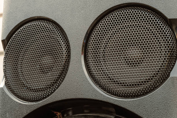istock Two audio mid speaker in sound box. Loudspeakers protected by metal mesh. 1356224606