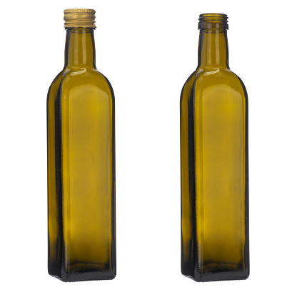 Olive oil green bottle isolated on the white. Close-up