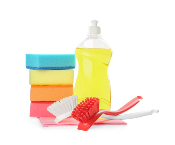 istock Cleaning supplies for dish washing on white background 1356225941