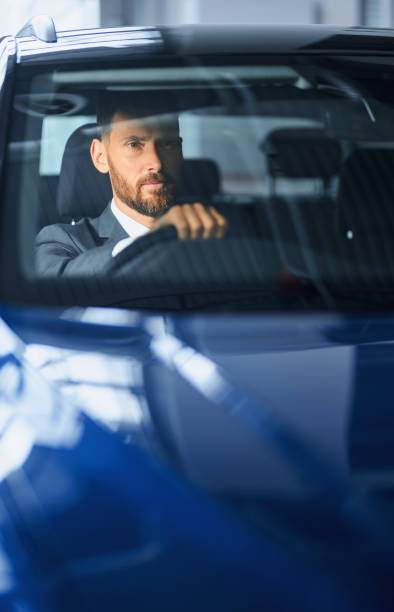 istock Male customer testing blue car before buying at salon 1356226000