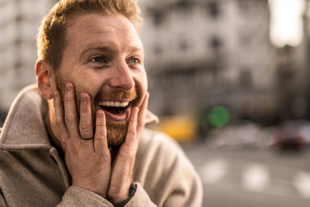 istock Amazed young man in the city. 1356226153