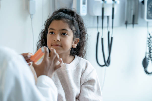 istock Young Patient Watching Doctor Explain How to Use an Inhaler 1356226865