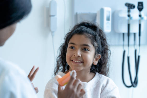 istock Young Patient Watching Doctor Explain How to Use an Inhaler 1356226866