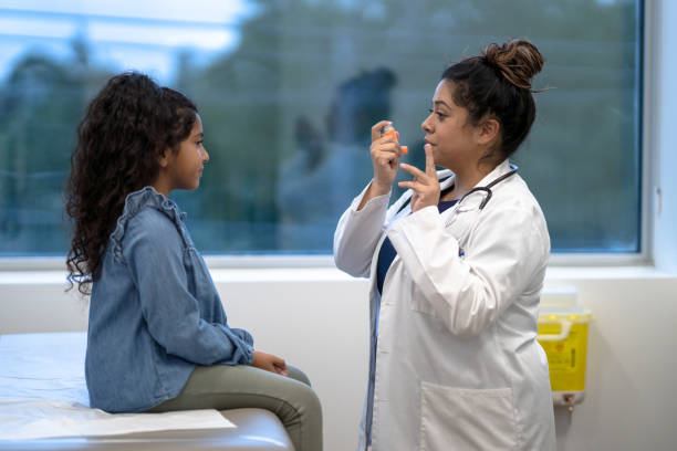 istock Doctor Instructing a Young Patient on Proper Inhaler Usage 1356226868