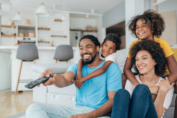 istock Family watching television 1356226948