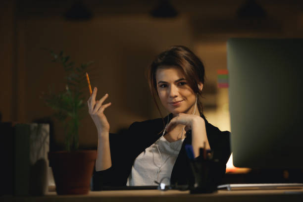 istock Woman with pencil posing and looking camera 1356227089