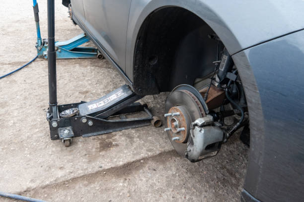 istock Photo of a car on a jack in analysis. 1356228518