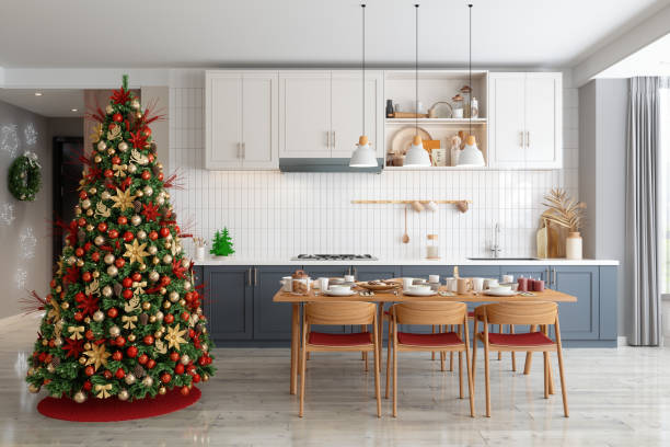 istock Modern Kitchen Interior With Christmas Tree, Dining Table, Chairs And White Cabinets 1356229031