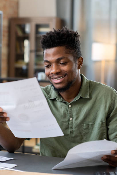 istock Smiling Young Blackman Receiving Letter 1356230027