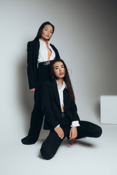 Two Female Models in Black Outfits Posing · Free Stock Photo