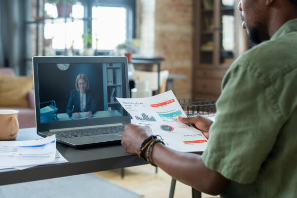istock Discussing Financial Papers With Advisor Online 1356230192