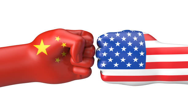 istock USA/China - bumping fists 1356230421