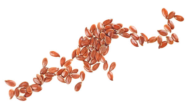 istock Flax seeds in a curved group isolated on a white background, top view. Linseeds. 1356232248