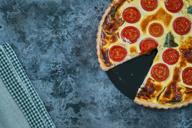 istock Fresh Baked Quiche with Tomatoes and Basil 1356234508