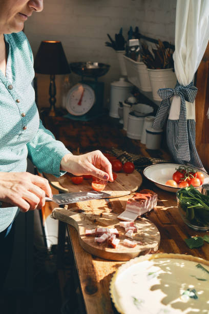 istock Preparing Quiche with Tomatoes and Basil 1356235097