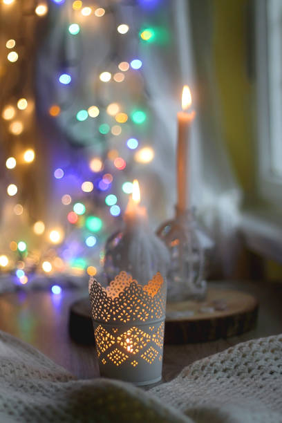istock Candle and Colorful Bokeh 1356238571