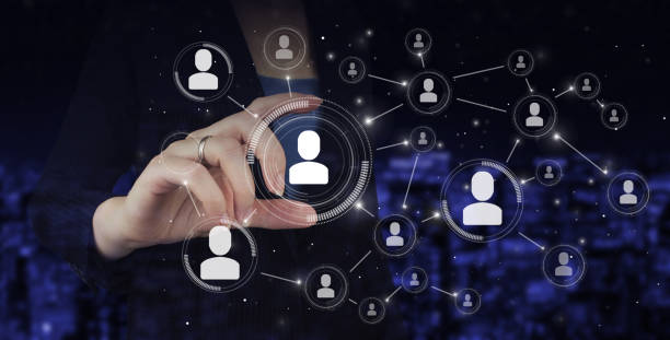 istock HR Human resources, peoples relation organisation structure. Hand hold digital hologram Human, Leader sign. Social media concept. Communication network. Recruitment Employment. 1356240779