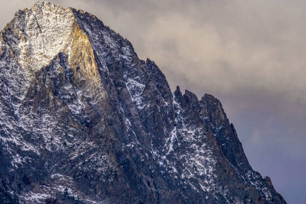 istock Large Mountain Peak With a Dusting of Snow 1356241833