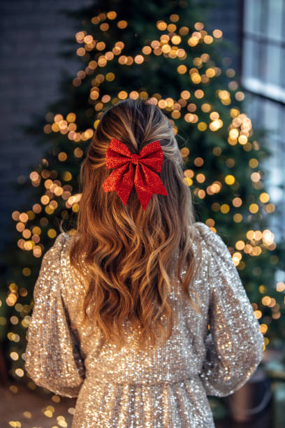 istock Little girl near Christmas tree 1356242018